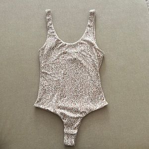 Kittenish leopard print bodysuit
